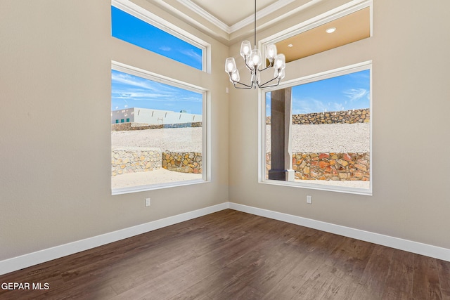 1848 Cimarron Park Dr, El Paso, TX 79911 - empty room featuring crown molding, dark wood-style flooring, baseboards, and an inviting chandelier