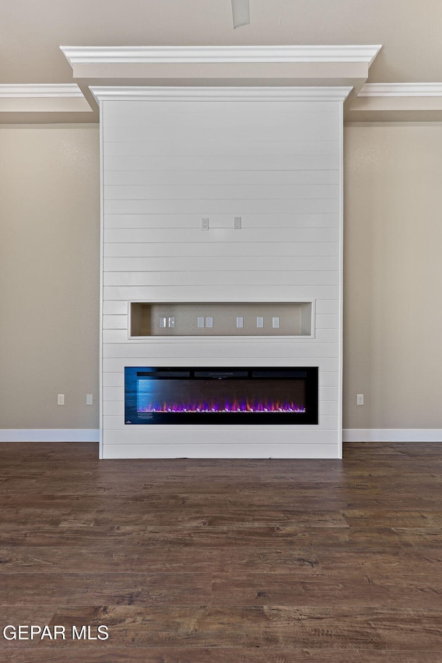 1848 Cimarron Park Dr, El Paso, TX 79911 - room details featuring crown molding, baseboards, a fireplace, and wood finished floors