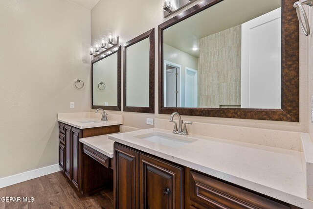 1848 Cimarron Park Dr, El Paso, TX 79911 - full bathroom with vanity, baseboards, and wood finished floors