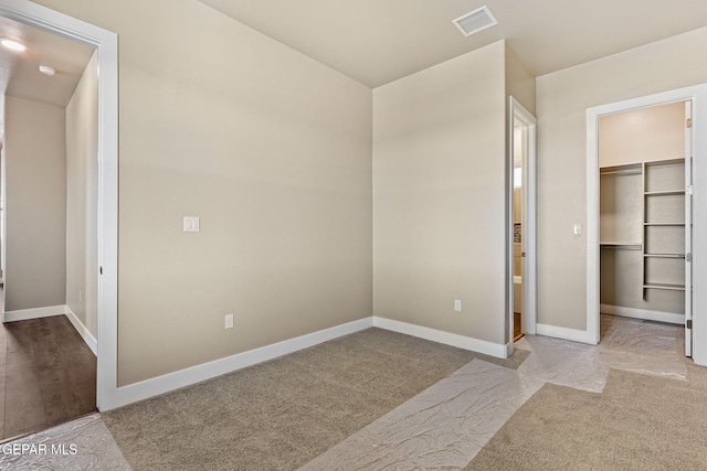 1848 Cimarron Park Dr, El Paso, TX 79911 - unfurnished bedroom featuring visible vents, carpet, a walk in closet, and baseboards