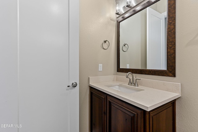 1848 Cimarron Park Dr, El Paso, TX 79911 - bathroom with a textured wall and vanity