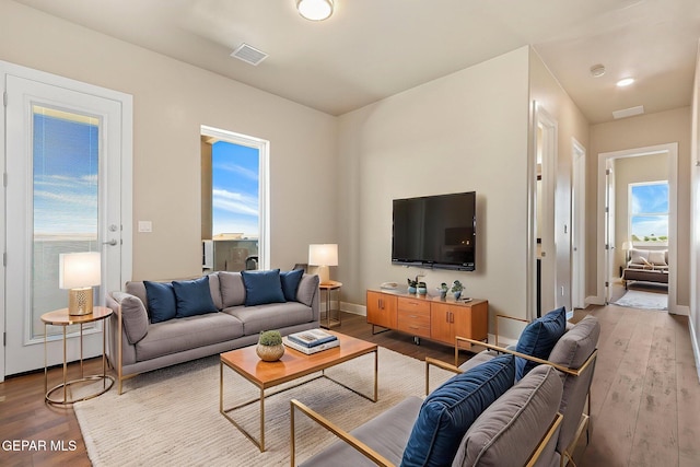 1848 Cimarron Park Dr, El Paso, TX 79911 - living room with baseboards, wood finished floors, and visible vents