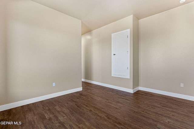 1848 Cimarron Park Dr, El Paso, TX 79911 - unfurnished room featuring baseboards and dark wood-type flooring