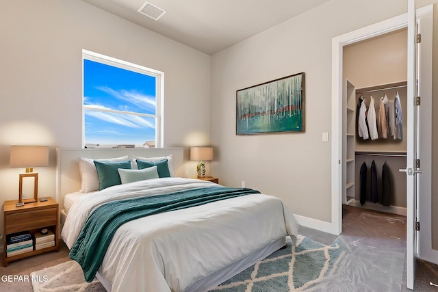 1848 Cimarron Park Dr, El Paso, TX 79911 - bedroom with a walk in closet, visible vents, baseboards, a closet, and carpet