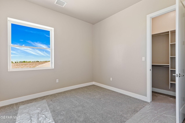1848 Cimarron Park Dr, El Paso, TX 79911 - unfurnished bedroom featuring a spacious closet, carpet, and visible vents
