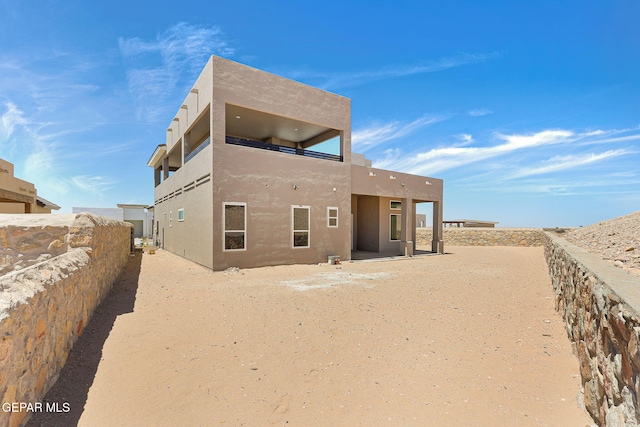 1848 Cimarron Park Dr, El Paso, TX 79911 - back of house featuring stucco siding and fence