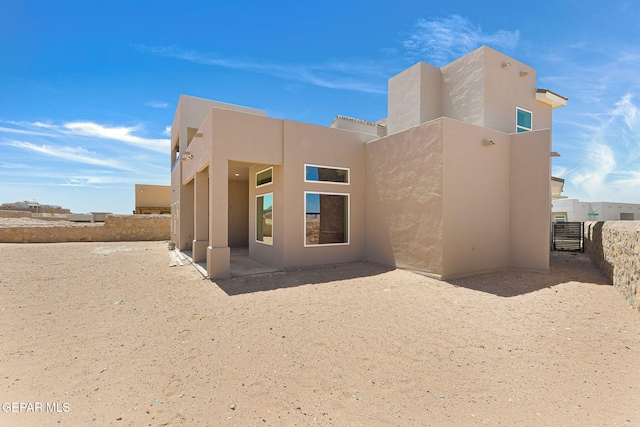 1848 Cimarron Park Dr, El Paso, TX 79911 - back of property with fence and stucco siding