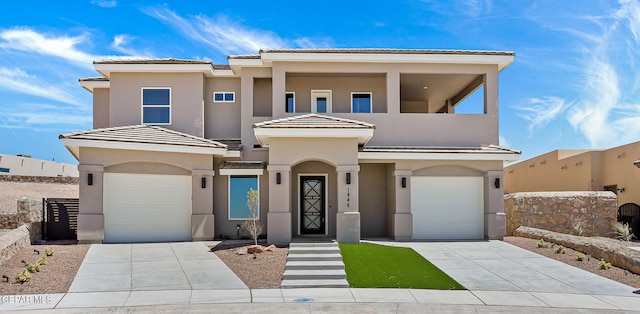 1848 Cimarron Park Dr, El Paso, TX 79911 - mediterranean / spanish-style home with a garage, stucco siding, concrete driveway, and a tiled roof