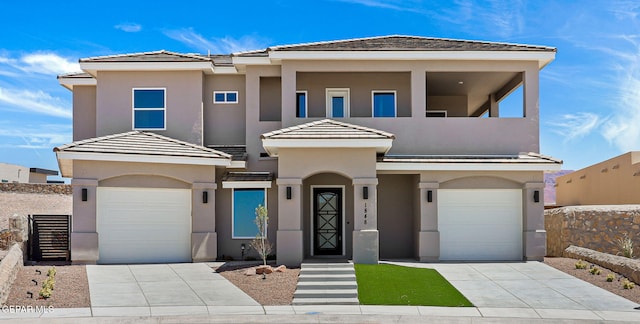 1848 Cimarron Park Dr, El Paso, TX 79911 - view of front of home with an attached garage, concrete driveway, and stucco siding