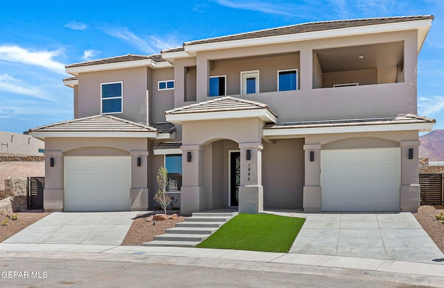 1848 Cimarron Park Dr, El Paso, TX 79911 - view of front facade featuring an attached garage, stucco siding, and driveway