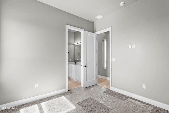 unfurnished bedroom featuring light wood-type flooring