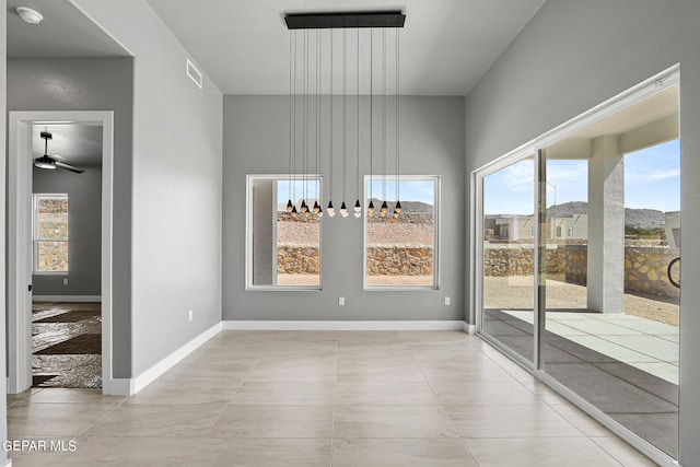 interior space featuring a healthy amount of sunlight and ceiling fan