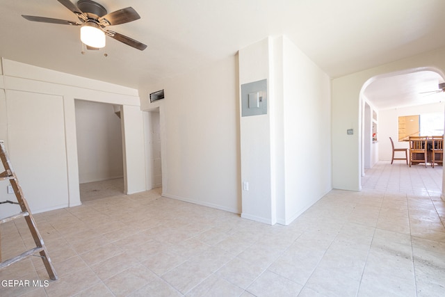 interior space featuring ceiling fan and light tile floors