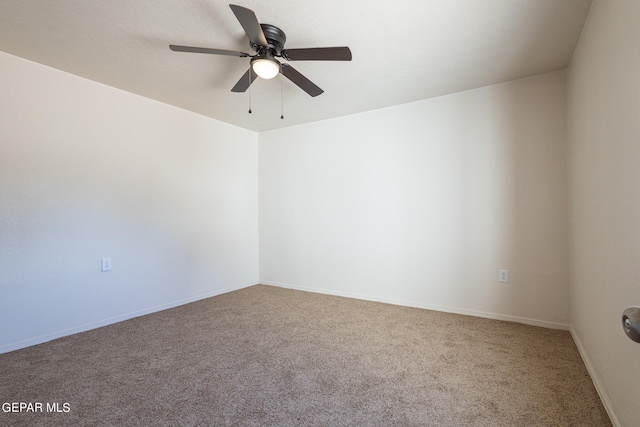 unfurnished room featuring ceiling fan and carpet floors