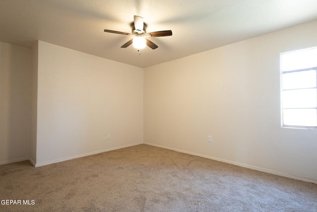 unfurnished room with carpet and ceiling fan