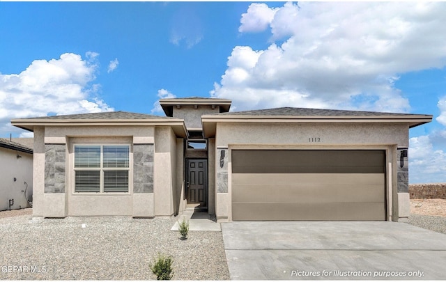 prairie-style house featuring a garage