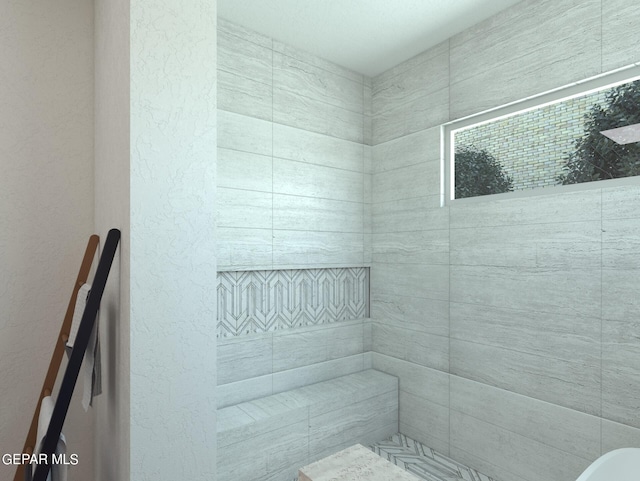 bathroom featuring tiled shower