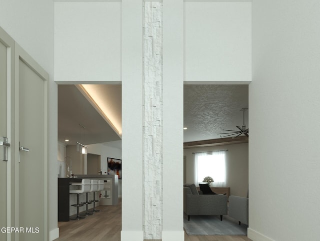 interior space featuring a textured ceiling and light hardwood / wood-style floors