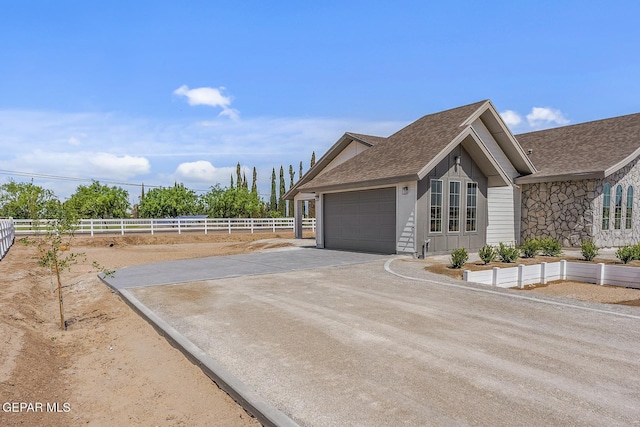 view of side of home featuring a garage