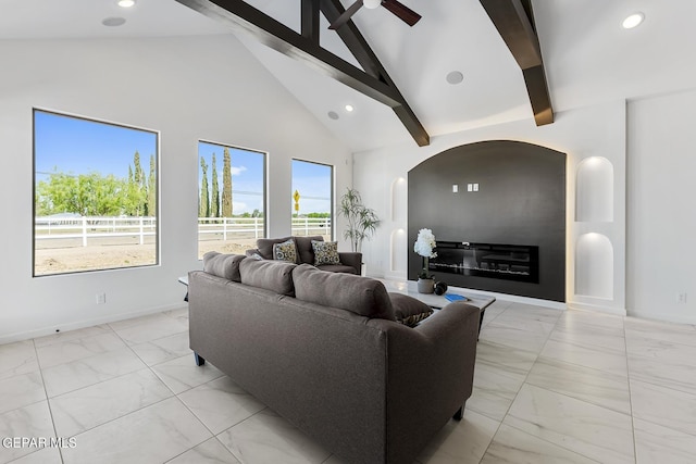 living room with ceiling fan, beamed ceiling, and high vaulted ceiling