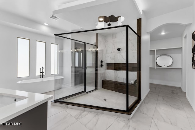 bathroom featuring vanity and a shower with shower door