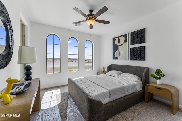 bedroom featuring ceiling fan and carpet floors