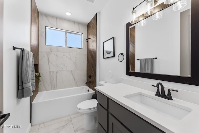 full bathroom with vanity, toilet, and tiled shower / bath