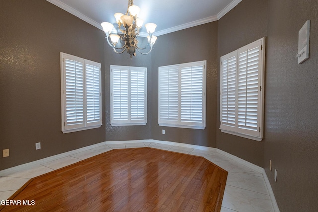 18 Via Placita, El Paso, TX 79927 - unfurnished dining area with a chandelier, tile patterned floors, crown molding, and baseboards