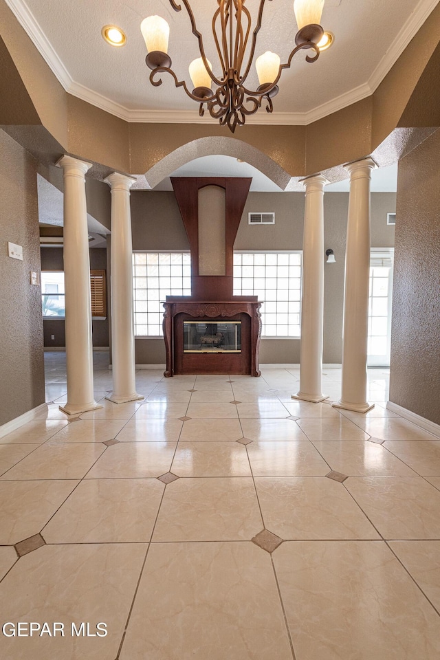 18 Via Placita, El Paso, TX 79927 - hall with ornamental molding, a textured wall, ornate columns, and baseboards