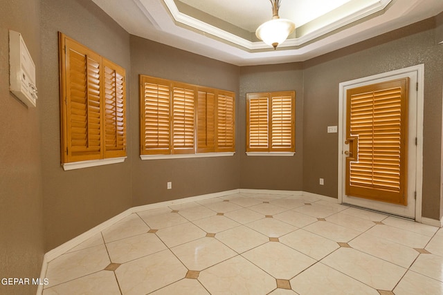 18 Via Placita, El Paso, TX 79927 - empty room with light tile patterned flooring and a tray ceiling