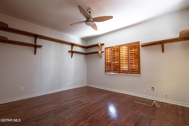 unfurnished room with ceiling fan and dark wood-type flooring