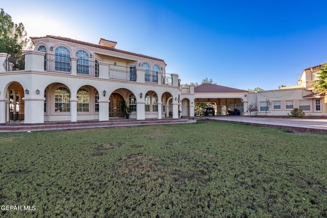 18 Via Placita, El Paso, TX 79927 - back of property featuring a balcony, a lawn, a chimney, stucco siding, and a tiled roof