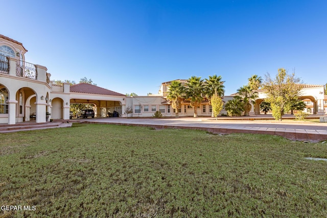 18 Via Placita, El Paso, TX 79927 - view of grassy yard featuring a balcony