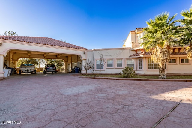 18 Via Placita, El Paso, TX 79927 - exterior space with a tiled roof, stucco siding, and driveway
