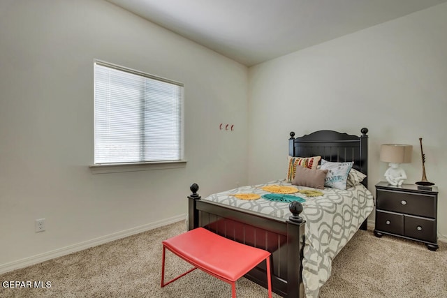 bedroom featuring light colored carpet