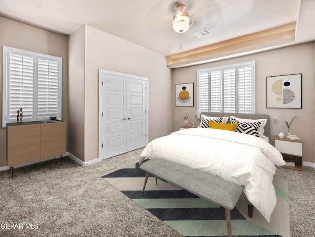 bedroom with ceiling fan, light carpet, radiator, and a closet