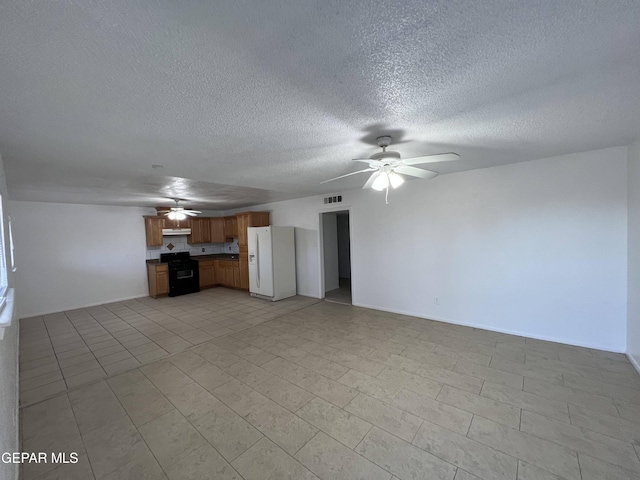 unfurnished living room featuring ceiling fan, light tile floors, and a textured ceiling