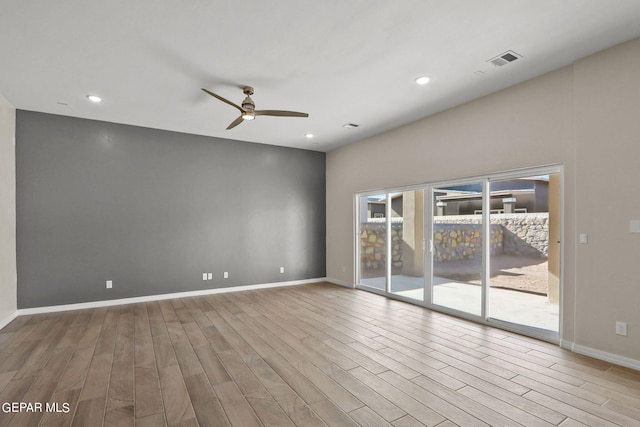 unfurnished room featuring light hardwood / wood-style flooring and ceiling fan