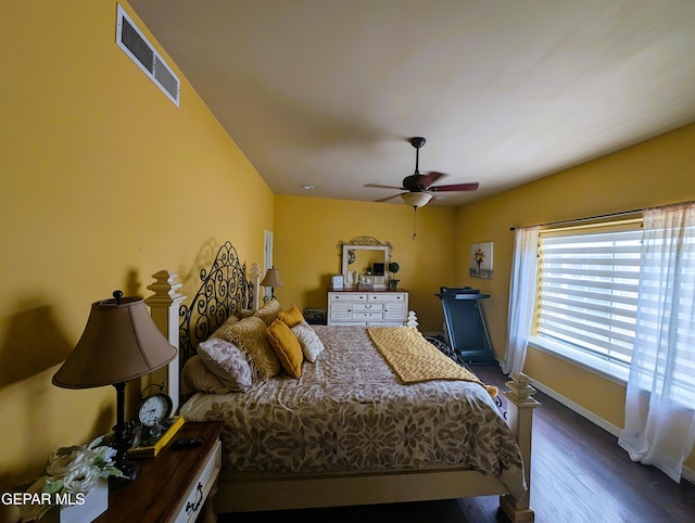 bedroom featuring dark hardwood / wood-style floors and ceiling fan