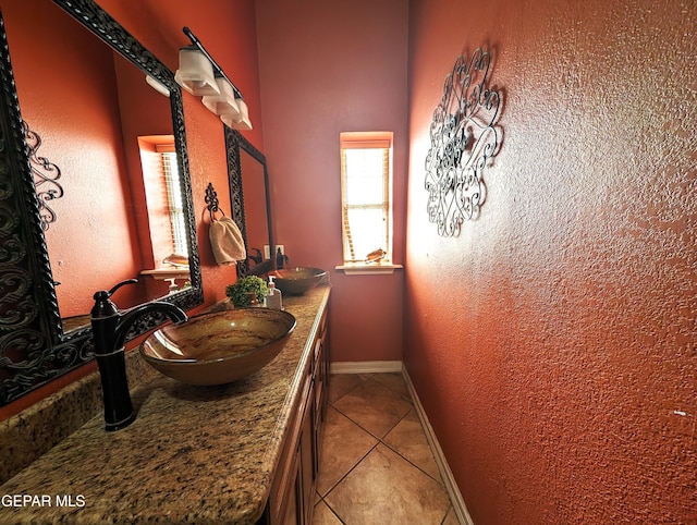 bathroom featuring tile patterned flooring and vanity