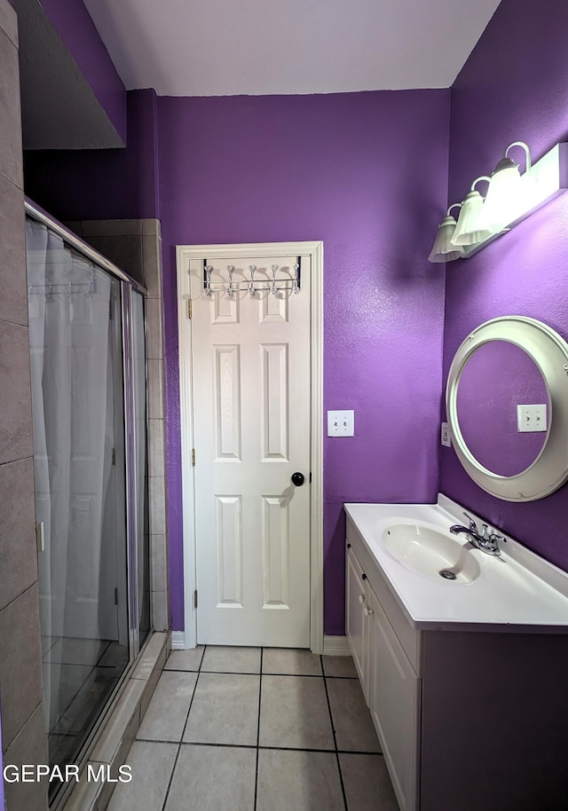 bathroom with vanity, a shower with curtain, and tile patterned floors