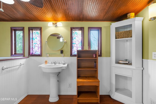 bathroom featuring hardwood / wood-style floors, ceiling fan, and wood ceiling