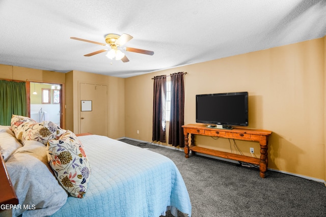 carpeted bedroom featuring ceiling fan and a textured ceiling