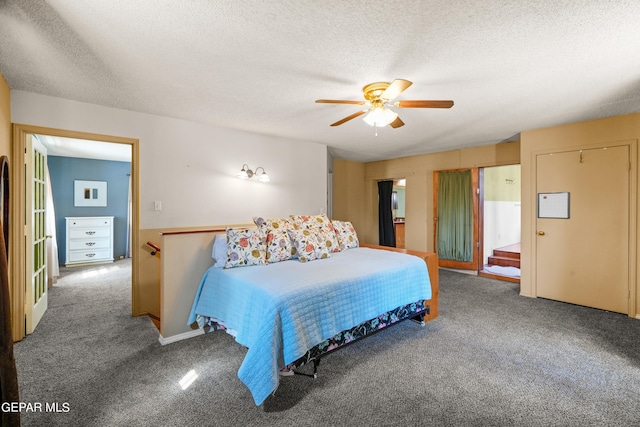 bedroom featuring a textured ceiling, ceiling fan, and carpet floors