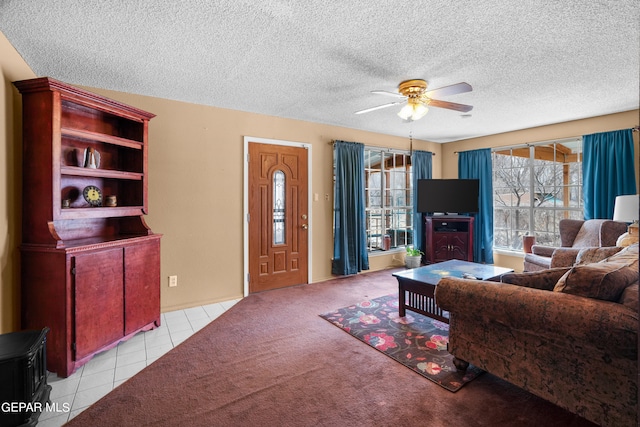 carpeted living room with a textured ceiling and ceiling fan