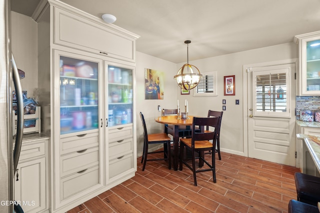 dining space with a chandelier