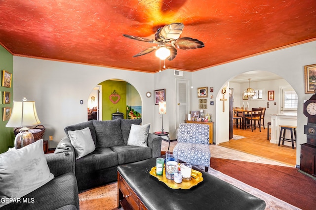 living room featuring hardwood / wood-style floors and ceiling fan