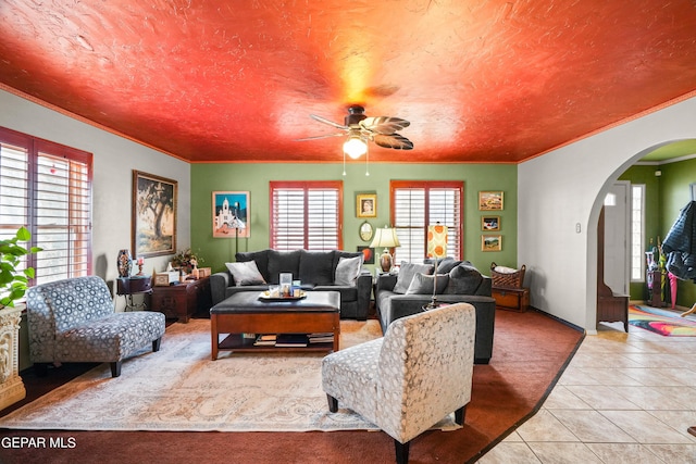 living room with ceiling fan and light tile flooring