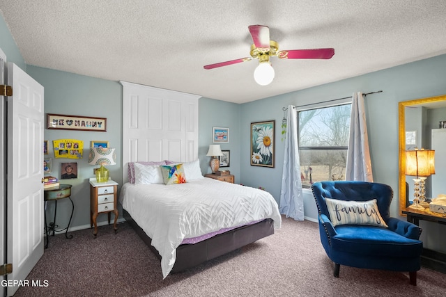 carpeted bedroom featuring ceiling fan and a textured ceiling