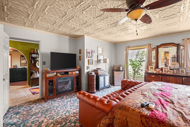 bedroom with ceiling fan and tile flooring